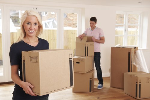 Planning removals in Acton with packing materials and labelled boxes