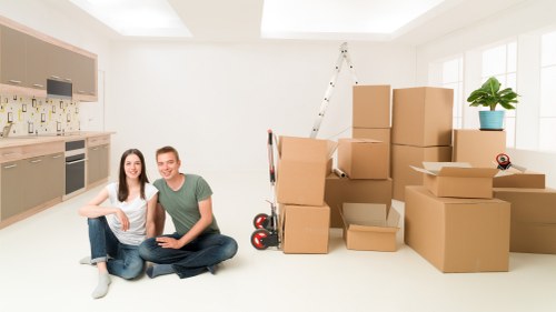 Organized secure storage unit in Acton with neatly packed boxes and furniture