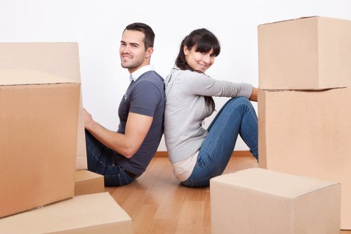 Household items being packed securely for an Acton move
